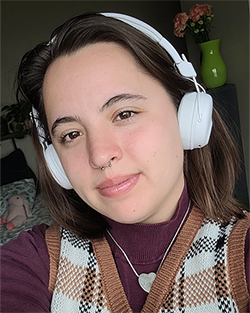 cali scholes wearing headphones